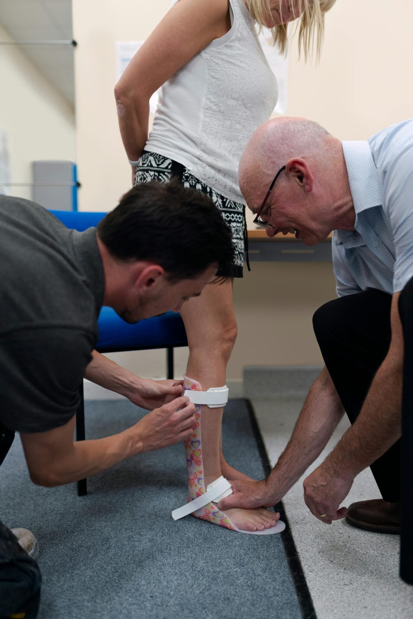 Someone holding orthotics